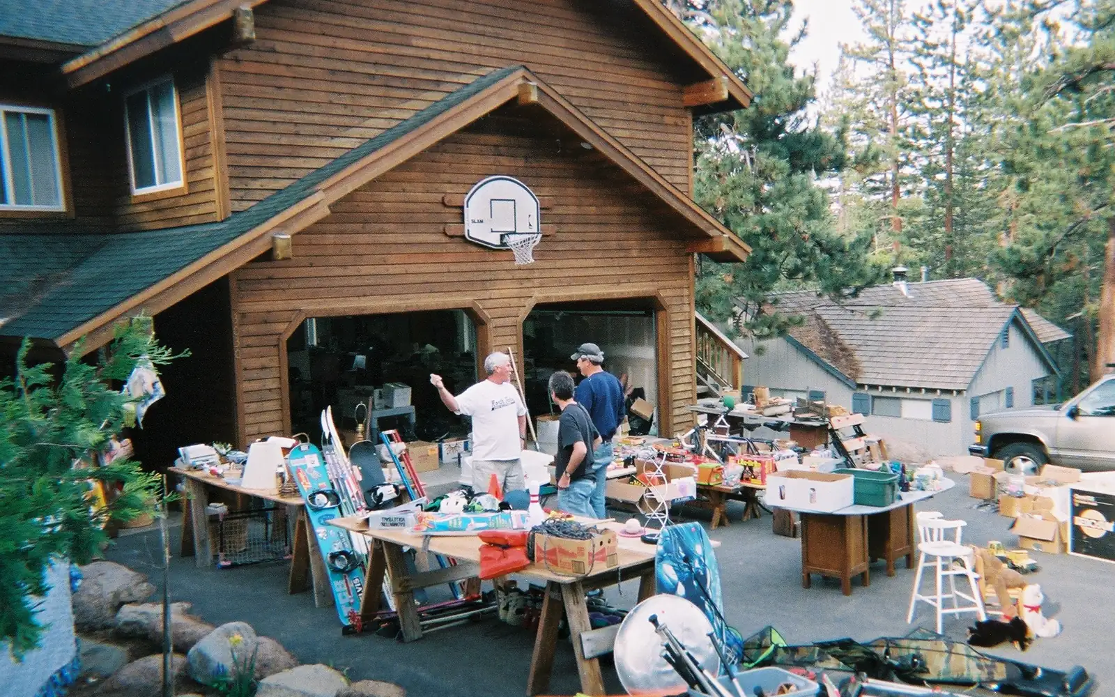 Tables of used household goods and sports gear set out at a sale